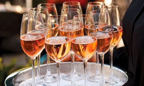 glasses-of-rose-champagne-served-at-reception